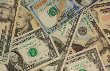 US dollar background by Iluhanos via iStock