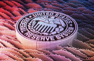 A stylized image of the Federal Reserve seal.
